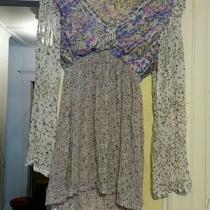 Pretty long sleeve top with purple floral pattern.